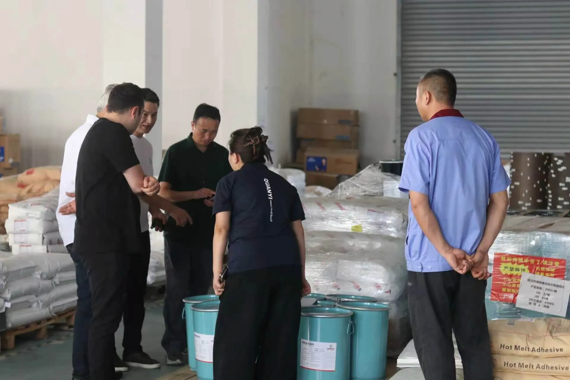 Factory team discussing product samples with overseas buyers
